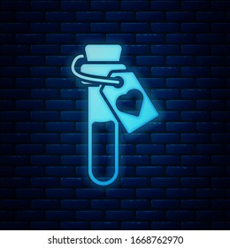 Glowing neon Bottle with love potion icon isolated on brick wall background. Valentines day symbol.  Vector Illustration