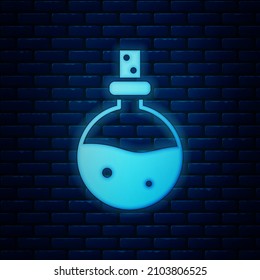 Glowing neon Bottle with love potion icon isolated on brick wall background. Valentines day symbol.  Vector Illustration