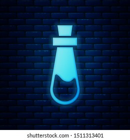 Glowing neon Bottle with potion icon isolated on brick wall background. Flask with magic potion. Happy Halloween party.  Vector Illustration