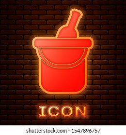 Glowing neon Bottle of wine in an ice bucket icon isolated on brick wall background.  Vector Illustration