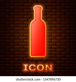 Glowing neon Bottle of wine icon isolated on brick wall background.  Vector Illustration