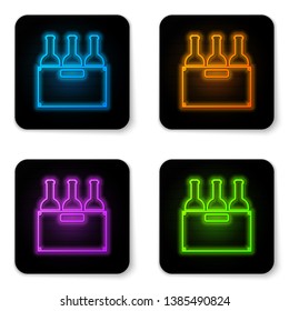 Glowing neon Bottles of wine in a wooden box icon isolated on white background. Wine bottles in a wooden crate icon. Black square button. Vector Illustration