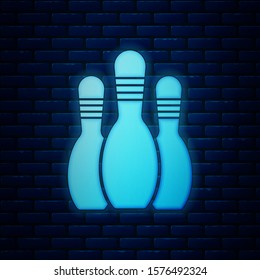 Glowing neon Bowling pin icon isolated on brick wall background.  Vector Illustration