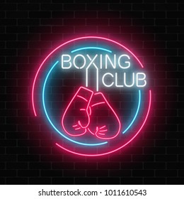 Glowing neon boxing club sign in circle frames on dark brick wall background. Fighting club neon signboard. Nightlife advertising symbol of sport facility on boxing theme . Vector illustration.