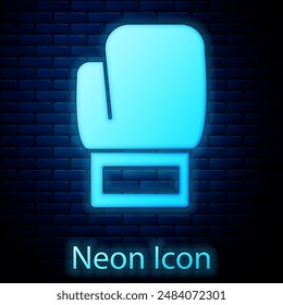 Glowing neon Boxing glove icon isolated on brick wall background.  Vector
