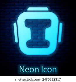 Glowing neon Boxing helmet icon isolated on brick wall background.  Vector