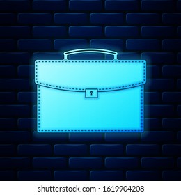 Glowing neon Briefcase icon isolated on brick wall background. Business case sign. Business portfolio.  Vector Illustration