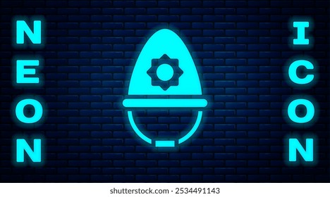 Glowing neon British police helmet icon isolated on brick wall background.  Vector
