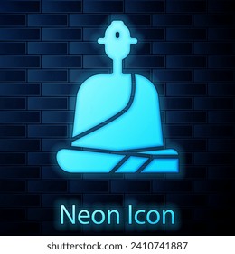 Glowing neon Buddhist monk in robes sitting in meditation icon isolated on brick wall background.  Vector Illustration