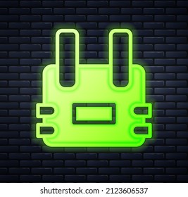 Glowing neon Bulletproof vest for protection from bullets icon isolated on brick wall background. Body armor sign. Military clothing.  Vector