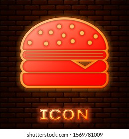 Glowing neon Burger icon isolated on brick wall background. Hamburger icon. Cheeseburger sandwich sign.  Vector Illustration