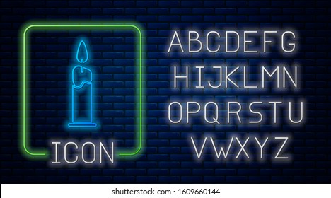 Glowing neon Burning candle in candlestick icon isolated on brick wall background. Cylindrical candle stick with burning flame. Neon light alphabet. Vector Illustration