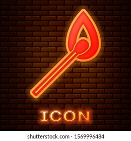 Glowing neon Burning match with fire icon isolated on brick wall background. Match with fire. Matches sign.  Vector Illustration