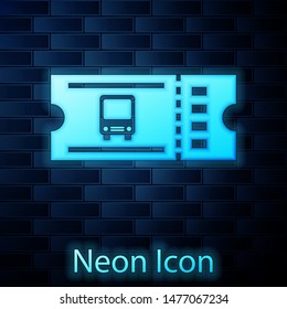 Glowing neon Bus ticket icon isolated on brick wall background. Public transport ticket.  Vector Illustration