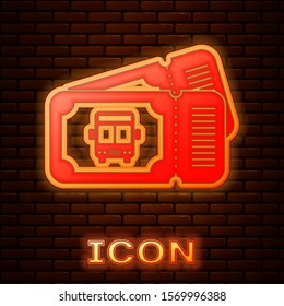 Glowing neon Bus ticket icon isolated on brick wall background. Public transport ticket.  Vector Illustration