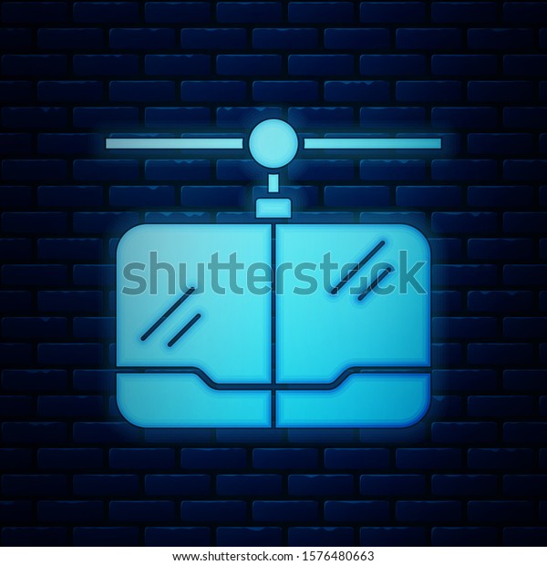Glowing neon Cable car icon\
isolated on brick wall background. Funicular sign.  Vector\
Illustration