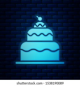 Glowing neon Cake icon isolated on brick wall background. Happy Birthday.  Vector Illustration
