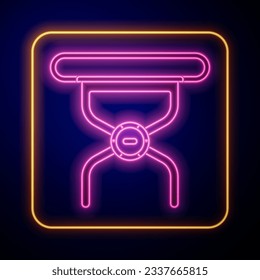 Glowing neon Camping portable folding chair icon isolated on black background. Rest and relax equipment. Fishing seat.  Vector