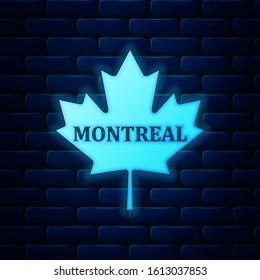 Glowing neon Canadian maple leaf with city name Montreal icon isolated on brick wall background.  Vector Illustration