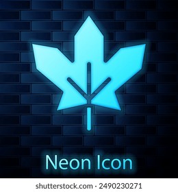 Glowing neon Canadian maple leaf icon isolated on brick wall background. Canada symbol maple leaf.  Vector