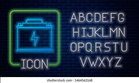 Glowing neon Car battery icon isolated on brick wall background. Accumulator battery energy power and electricity accumulator battery. Lightning bolt. Neon light alphabet. Vector Illustration