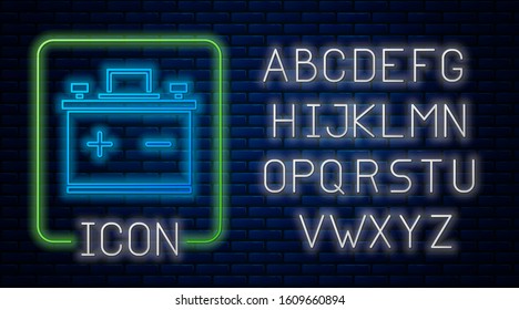 Glowing neon Car battery icon isolated on brick wall background. Accumulator battery energy power and electricity accumulator battery. Neon light alphabet. Vector Illustration