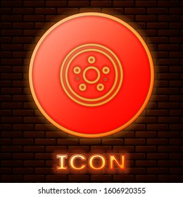 Glowing neon Car brake disk icon isolated on brick wall background.  Vector Illustration