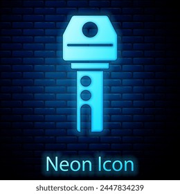 Glowing neon Car key with remote icon isolated on brick wall background. Car key and alarm system.  Vector