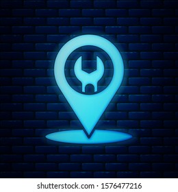 Glowing neon Car service icon isolated on brick wall background. Auto mechanic service. Repair service auto mechanic. Maintenance sign.  Vector Illustration