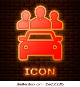 Glowing neon Car sharing with group of people icon isolated on brick wall background. Carsharing sign. Transport renting service concept.  Vector Illustration