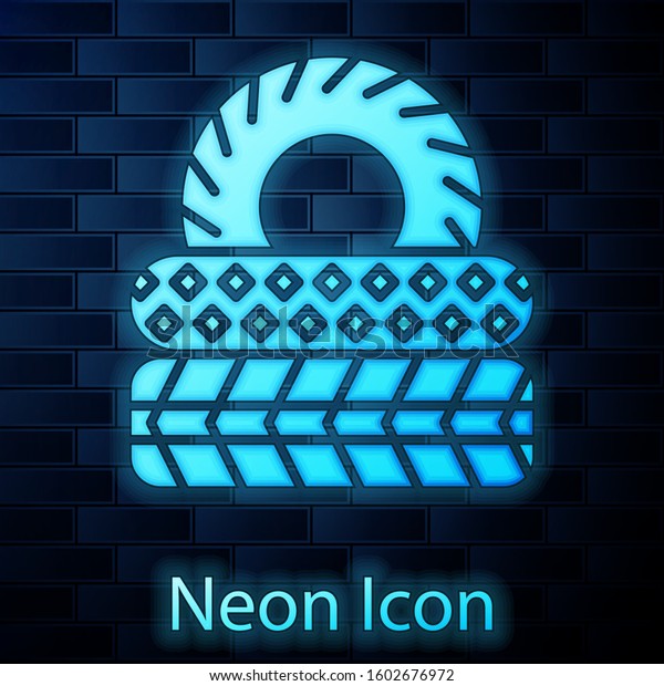 Glowing neon Car tire icon isolated on brick\
wall background.  Vector\
Illustration