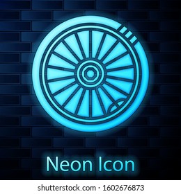 Glowing neon Car wheel icon isolated on brick wall background.  Vector Illustration