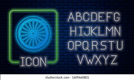 Glowing neon Car wheel icon isolated on brick wall background. Neon light alphabet. Vector Illustration