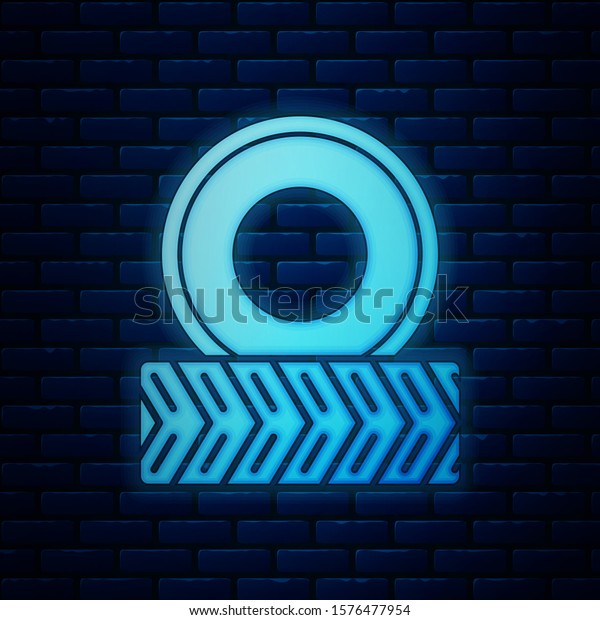 Glowing neon Car wheel icon isolated on\
brick wall background.  Vector\
Illustration