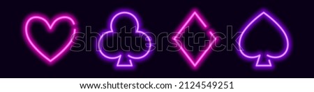 Glowing neon card suit symbols. Purple clubs and spades for a gambling poker game. Heart and diamonds for lucky vector win and jackpot