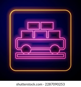 Glowing neon Cargo train wagon icon isolated on black background. Full freight car. Railroad transportation.  Vector