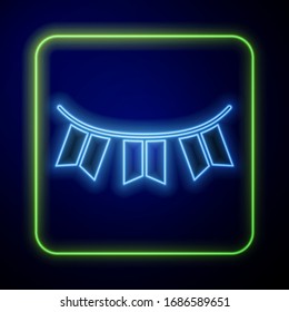 Glowing neon Carnival garland with flags icon isolated on blue background. Party pennants for birthday celebration, festival decoration.  Vector Illustration