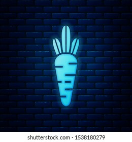 Glowing neon Carrot icon isolated on brick wall background.  Vector Illustration