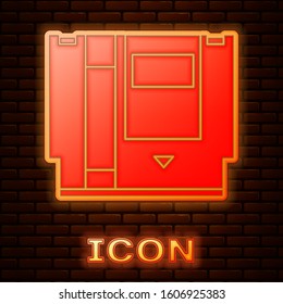 Glowing neon Cartridge for retro game console icon isolated on brick wall background. TV Game cartridge.  Vector Illustration