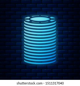 Glowing neon Casino chips icon isolated on brick wall background. Casino gambling.  Vector Illustration