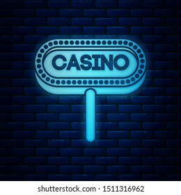 Glowing neon Casino signboard icon isolated on brick wall background.  Vector Illustration