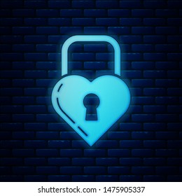 Glowing neon Castle in the shape of a heart icon isolated on brick wall background. Locked Heart. Love symbol and keyhole sign.  Vector Illustration