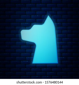Glowing neon Cat icon isolated on brick wall background.  Vector Illustration