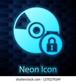 Glowing neon CD or DVD disk with closed padlock icon isolated on brick wall background. Compact disc sign. Security, safety, protection concept. Vector Illustration