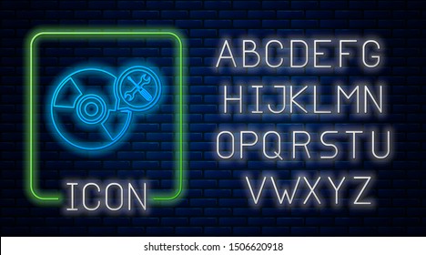 Glowing neon CD or DVD disk with screwdriver and wrench icon isolated on brick wall background Neon light alphabet. Vector Illustration