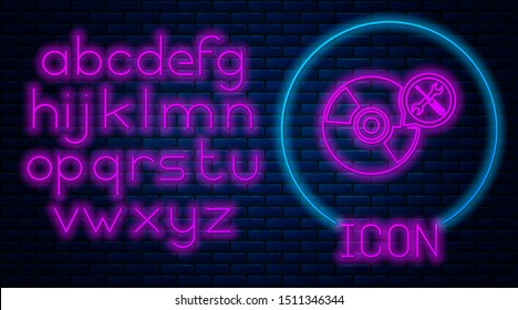 Glowing neon CD or DVD disk with screwdriver and wrench icon isolated on brick wall background. Adjusting, service, setting, maintenance, repair, fixing. Neon light alphabet. Vector Illustration