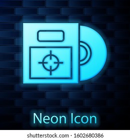 Glowing neon CD or DVD disk in box icon isolated on brick wall background. Compact disc sign.  Vector Illustration