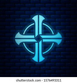 Glowing neon Celtic cross icon isolated on brick wall background. Happy Saint Patricks day.  Vector Illustration
