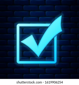 Glowing neon Check mark in a box icon isolated on brick wall background. Tick symbol. Check list button sign.  Vector Illustration