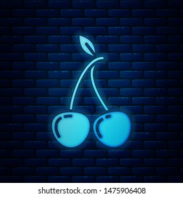 Glowing neon Cherry icon isolated on brick wall background. Fruit with leaf symbol.  Vector Illustration